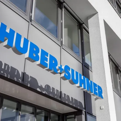 HUBER+SUHNER, ANGA COM 2025, fiber optic solutions, data center connectivity, GNSS timing, FTTH, HFC, optical circuit switching